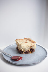 Three layered Pate Chinois on a blue plate in a clean white background