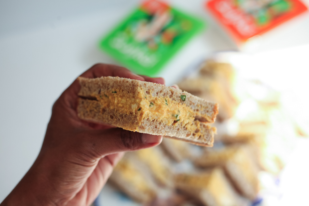 hand holding sandwich
